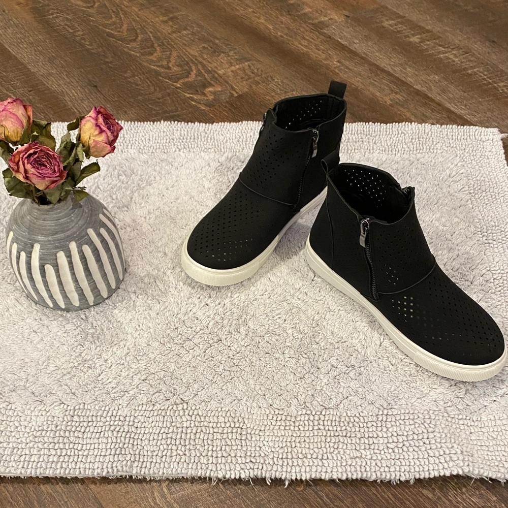 Black perforated zip up sneakers